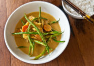 <div class="caption-credit"> Photo by: Photo by Sarah Flotard</div><b>Yellow Curry Chicken</b> <br> <br> In a skillet, sauté sliced onion and carrot rounds in a little vegetable oil until tender. Stir in some Thai yellow curry paste (available at Asian markets and in the Asian foods section of many supermarkets; Thai and True makes an especially bright and fresh version). Thin curry to a saucy consistency with canned unsweetened coconut milk and low-sodium chicken broth. Add trimmed green beans; cook until crisp-tender. Add chunks of chicken and continue to cook curry mixture until chicken is just heated through. Serve over cooked jasmine rice.