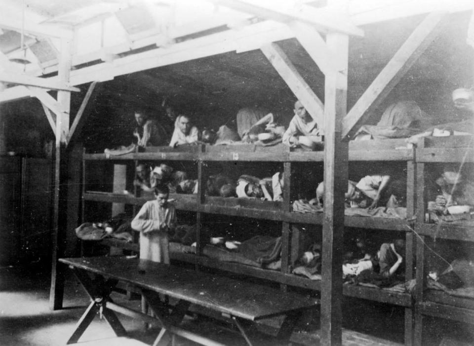 Inmates lying on bunks after liberation (Reuters Pictures Archive).JPG