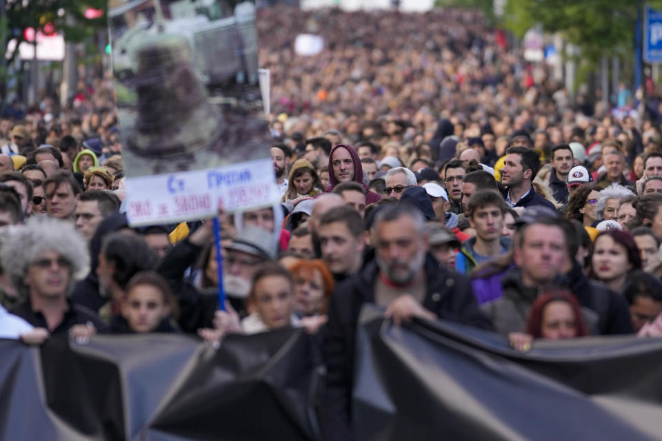 People march during a rally against violence in Belgrade, Serbia, Friday, May 12, 2023. Serbia’s populist leader has sharply denounced opposition plans to block a key bridge and highway in Belgrade on Friday to press their demands in the wake of last week’s mass shootings in the Balkan country that left 17 people dead, including many children. (AP Photo/Darko Vojinovic)