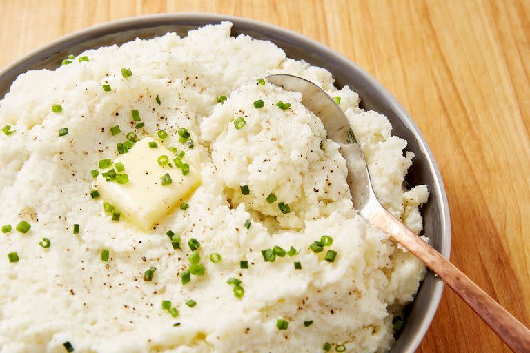 <p>This cauliflower mash recipe is the perfect low-carb substitute to mashed potatoes. The secret to making steamed cauliflower smooth and creamy? CREAM CHEESE! </p><p>Get the <a href="https://www.delish.com/uk/cooking/recipes/a29696163/mashed-cauliflower-recipe/" rel="nofollow noopener" target="_blank" data-ylk="slk:Mashed Cauliflower;elm:context_link;itc:0;sec:content-canvas" class="link ">Mashed Cauliflower</a> recipe.</p>