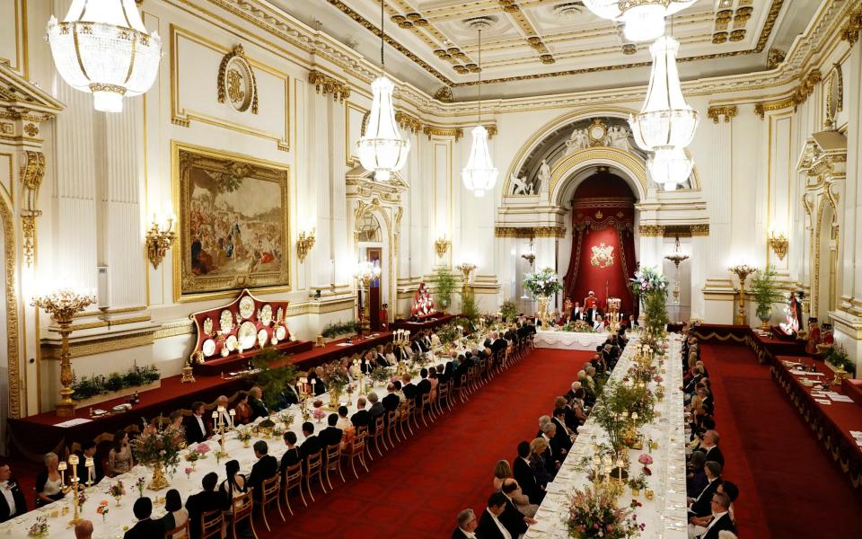 Guests take their seats in the Ballroom at Buckingham Palace for the State Banquet