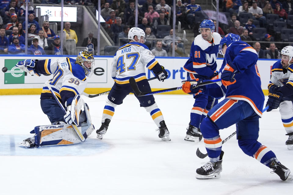 St. Louis Blues goaltender Joel Hofer (30) gives up a goal to New York Islanders' Jean-Gabriel Pageau during the second period of an NHL hockey game Tuesday, March 5, 2024, in Elmont, N.Y. (AP Photo/Frank Franklin II)