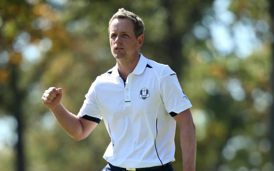 Luke Donald of Europe celebrates after holing out for birdie on the seventh green