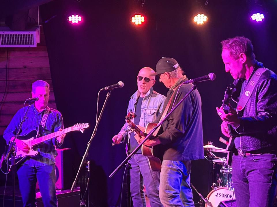 Pittsburgh harmonica player Marc Reisman, in denim jacket, joining Dan Bern on stage at Club Cafe.