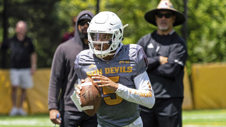 This Aug. 8, 2019, photo provided by Sun Devil Athletics shows Arizona State University freshman quarterback Jayden Daniels at practice in Payson, Ariz. Daniels will become the first Arizona State true freshman quarterback to start a season opener for the Sun Devils, as he won a four-man competition for the job. (Radmen Niven/Sun Devil Athletics via AP)