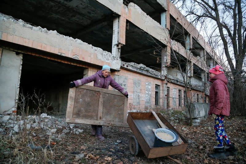 Local residents collect furniture parts for firewood in Horlivka