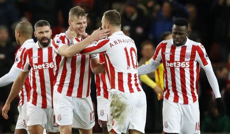 Britain Football Soccer - Stoke City v Watford - Premier League - bet365 Stadium - 3/1/17 Stoke City's Ryan Shawcross celebrates scoring their first goal with team mates Action Images via Reuters / Carl Recine Livepic EDITORIAL USE ONLY. No use with unauthorized audio, video, data, fixture lists, club/league logos or "live" services. Online in-match use limited to 45 images, no video emulation. No use in betting, games or single club/league/player publications. Please contact your account representative for further details.