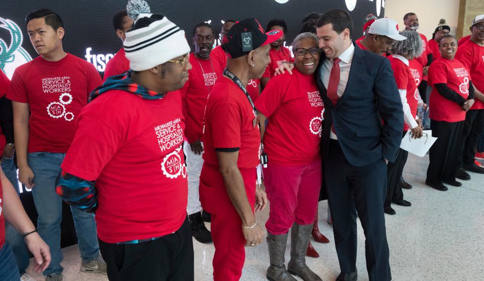 Milwaukee Bucks Senior Vice President Alex Lasry hugs workers Wednesday after an announcement of a labor agreement between Fiserv Forum and the Milwaukee Area Service and Hospitality Workers Organization Union.