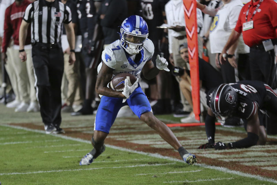 Kentucky wide receiver Barion Brown (7) steps out of bounds after a 14-yard reception for a first down during the first half of an NCAA college football game against South Carolina on Saturday, Nov. 18, 2023, in Columbia, S.C. (AP Photo/Artie Walker Jr.)