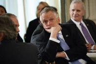 National Governors Association Chairman, Virginia Gov. Terry McAuliffe, center, waits for the arrival of President Donald Trump to a meeting of the NGA, Monday, Feb. 27, 2017, at the White House in Washington. Minnesota Gov. Mark Dayton is at right. (AP Photo/Evan Vucci)