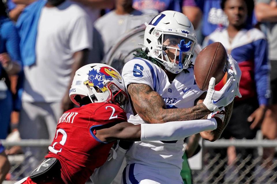 Duke wide receiver Eli Pancol (6) catches a pass under pressure from Kansas cornerback Cobee Bryant (2) during the first half of an NCAA college football game Saturday, Sept. 24, 2022, in Lawrence, Kan. 