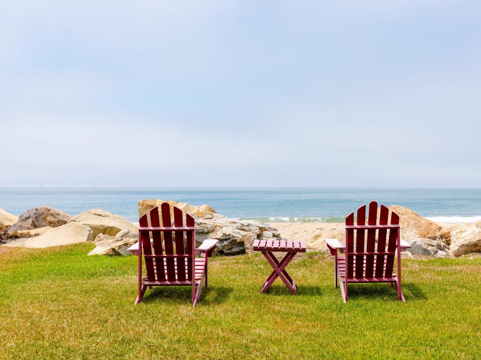 Two lounge chairs face the ocean outside Ashton Kutcher and Mila Kunis' beach house in California.