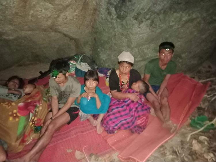 Ethnic Karen villagers displaced from Myanmar's Day Pu Noh village are seen in an unknown location after fleeing Burmese army air strikes