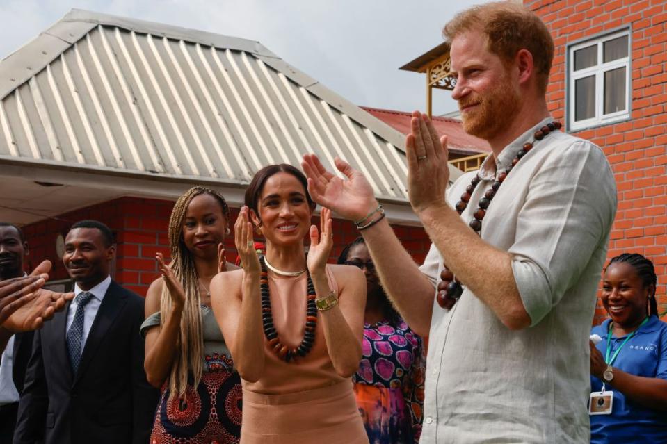 The couple, in Nigeria for the first time following an invitation from its military, began their trip with a visit to the Lightway Academy school. AFOLABI SOTUNDE/EPA-EFE/Shutterstock