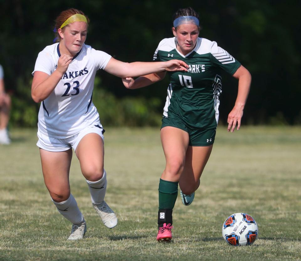 Wilmington Friends' Giuliana DiPrinzio (left) fights for the ball against Saint Mark's Whitney Evancho in the Spartans' 4-2 win in a DIAA Division II state tournament semifinal at Saint Mark's High School, Wednesday, May 31, 2023.