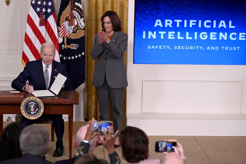 U.S. President Joe Biden applauds as he signs an executive order after delivering a speech on promoting the safe, secure, and trustworthy development and use of artificial intelligence in the East Room of the White House in Washington, DC, on October 30. US Vice President Kamala Harris.Biden will issue an Executive Order on the Regulation of Artificial Intelligence on October 30, 2023, allowing the U.S. 