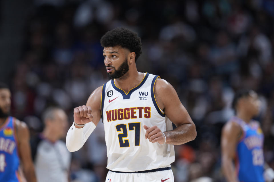 FILE - Denver Nuggets guard Jamal Murray (27) gestures in the first half of an NBA preseason basketball game Monday, Oct. 3, 2022, in Denver. This may just demonstrate how much Jamal Murray was missed: Before a preseason home game, he was introduced and the Denver Nuggets all rushed over to swarm him. (AP Photo/David Zalubowski, File)