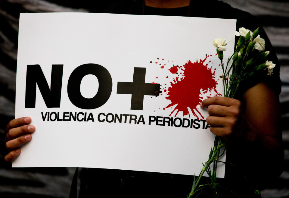 <p>A protestor holds a sign reading “No more violence against journalists,” during a demonstration outside the Interior Ministry in Mexico City, Tuesday, May 16, 2017. (AP Photo/Rebecca Blackwell) </p>