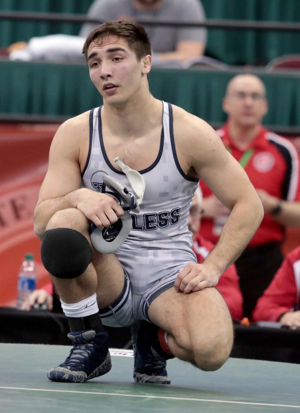 Fairless' Max Kirby is dejected after a loss in the  state championship Division II 165 pound match to Tyler Lillard of Aurora High School.