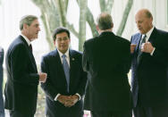 <p>From left to right, Federal Bureau of Investing Director Robert Mueller, U.S. Attorney General Alberto Gonzales, National Security Adviser Stephen Hadley and Director of National Intelligence John Negroponte talk outside the entrance to the CIA Headquarters after attending the ceremonial swearing-in for the new Director of the CIA, Gen. Michael Hayden, Wednesday, May 31, 2006 in Langley, Va. (Photo: Pablo Martinez Monsivais/AP) </p>