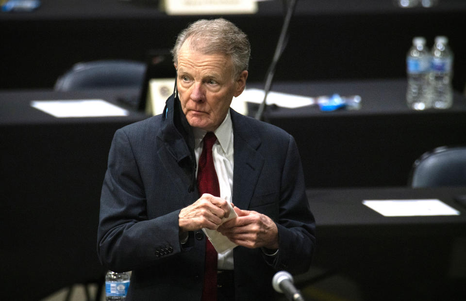 FILE - In this Jan. 8, 2021, file photo, Illinois House Speaker Michael Madigan appears on the floor as the Illinois House of Representatives convenes at the Bank of Springfield Center, in Springfield, Ill. Madigan, the Chicago Democrat who virtually set Illinois' political agenda as House speaker before he was ousted last month, resigned his seat Thursday, Feb. 18, 2021. Madigan marked 50 years as a state representative in January. (E. Jason Wambsgans/Chicago Tribune via AP, File)