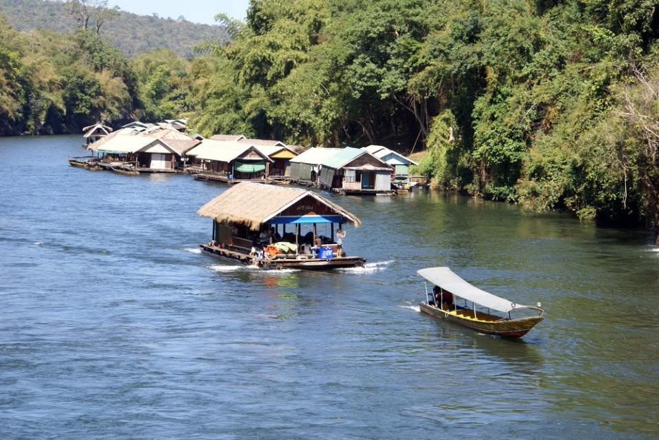 boats floating down the River Kwai in Central Thailand
