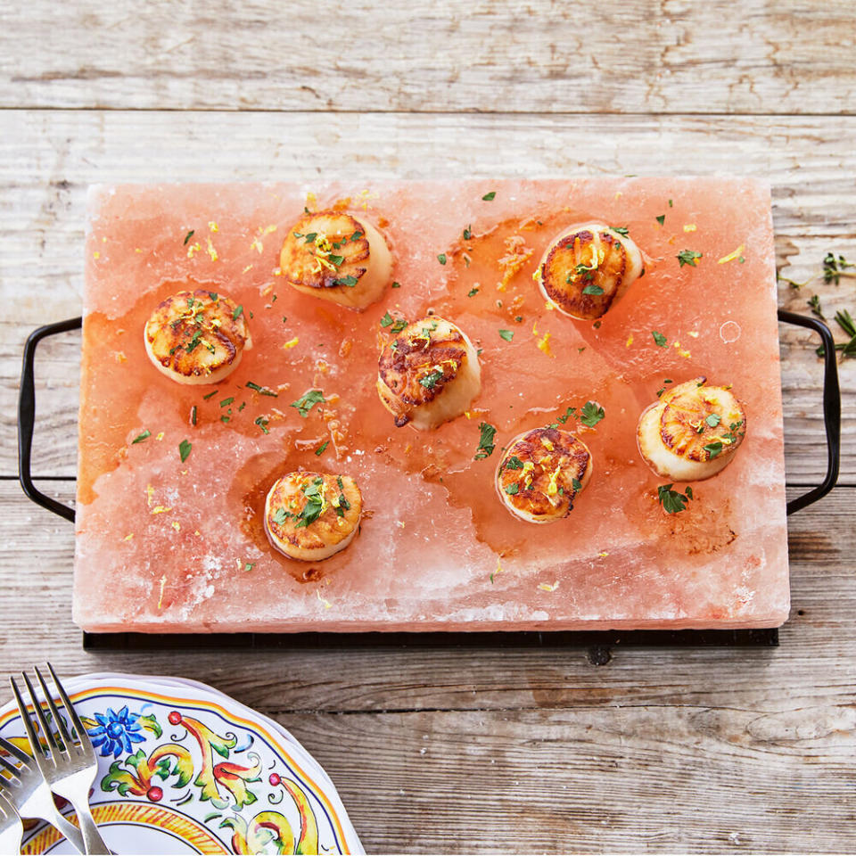 Chances are that if they love to cook, they love to wow their guests. <a href="https://fave.co/2rsRf9E" target="_blank" rel="noopener noreferrer">This Himalayan salt block</a> adds a new twist to fish preparation or food presentation.