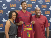 Cleveland Cavaliers first-round draft selection Evan Mobley, center, stands with is parents, Nicol, left, and Eric Mobley during a news conference at the NBA basketball team's training facility in Independence, Ohio, Friday, July 30, 2021. (AP Photo/Phil Long)