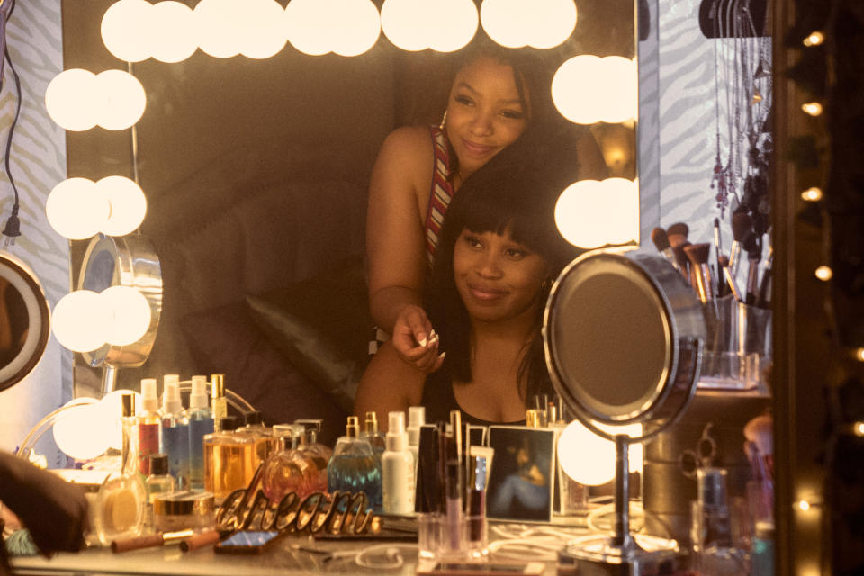 chloe bailey and dominique fishback looking into a mirror