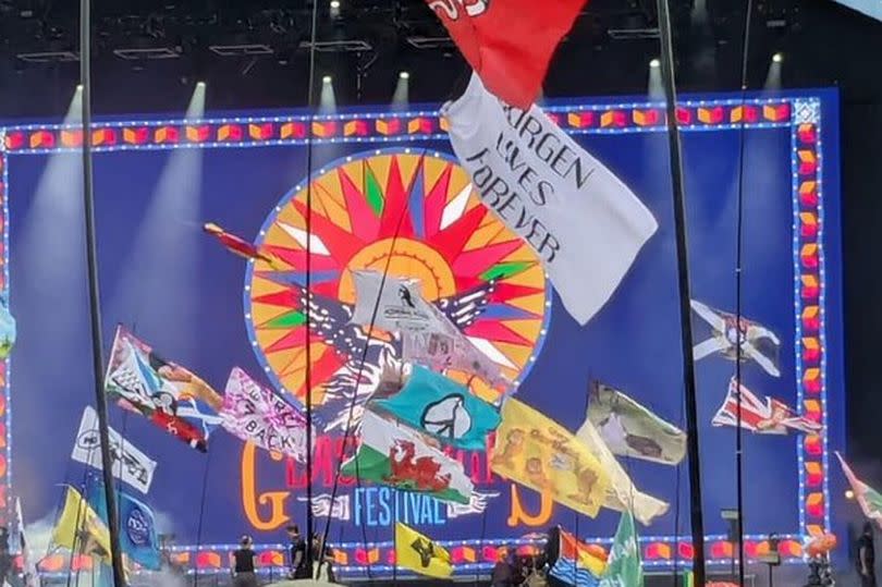 A banner reading 'Jurgen Lives Forever' at Glastonbury Festival.