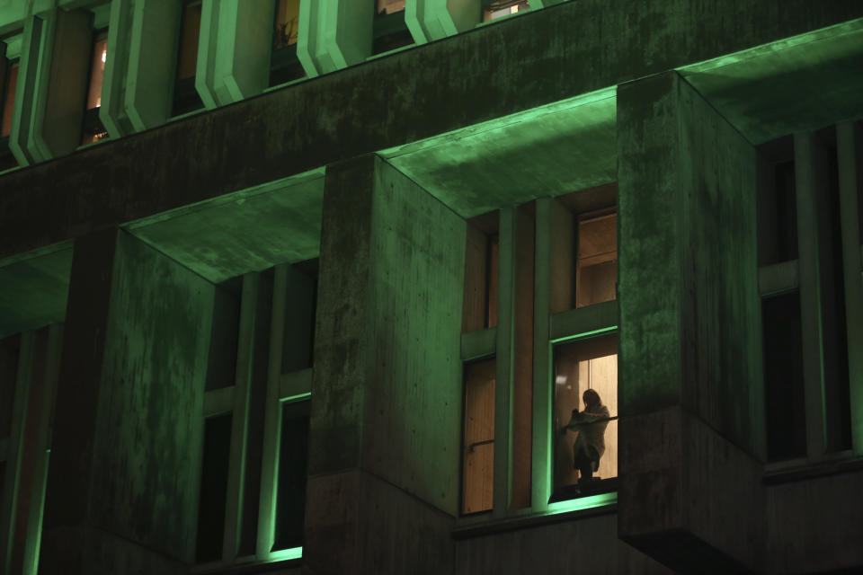 Boston City Hall is lit in green during Britain's Prince William and Kate, Princess of Wales', Welcome of Earthshot event on Wednesday, Nov. 30, 2022 in Boston, Mass. (AP Photo/Reba Saldanha)