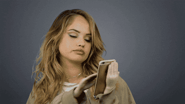 debby ryan swiping on a dating app