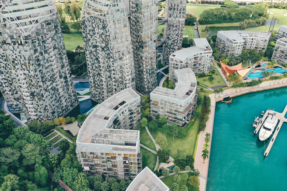 Modern and luxury smart homes in Singapore, seen from above during a hot summer day at the Keppel Bay Yacht Marina area in the city centre.