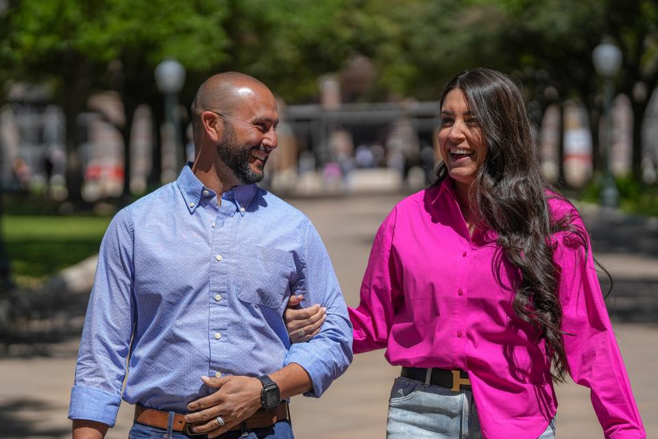 Rebecca Muñoz walks with her husband, Jason Perez, on Sunday at the Capitol. Muñoz was diagnosed with breast cancer in 2017 and is now free of any signs of the disease.