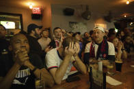 Fans react during a watch party at the Smithfield Hall NYC, Saturday, Dec. 3, 2022, New York, after the Netherlands scored a goal against the United States in the Qatar 2022 World Cup Round of 16 soccer match.(AP Photo/Yuki Iwamura)