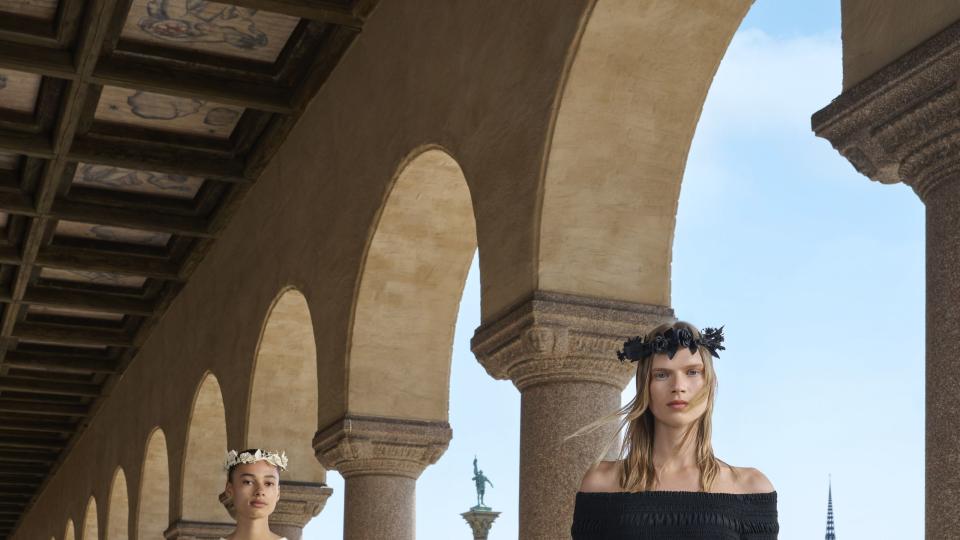 a couple of women in black dresses