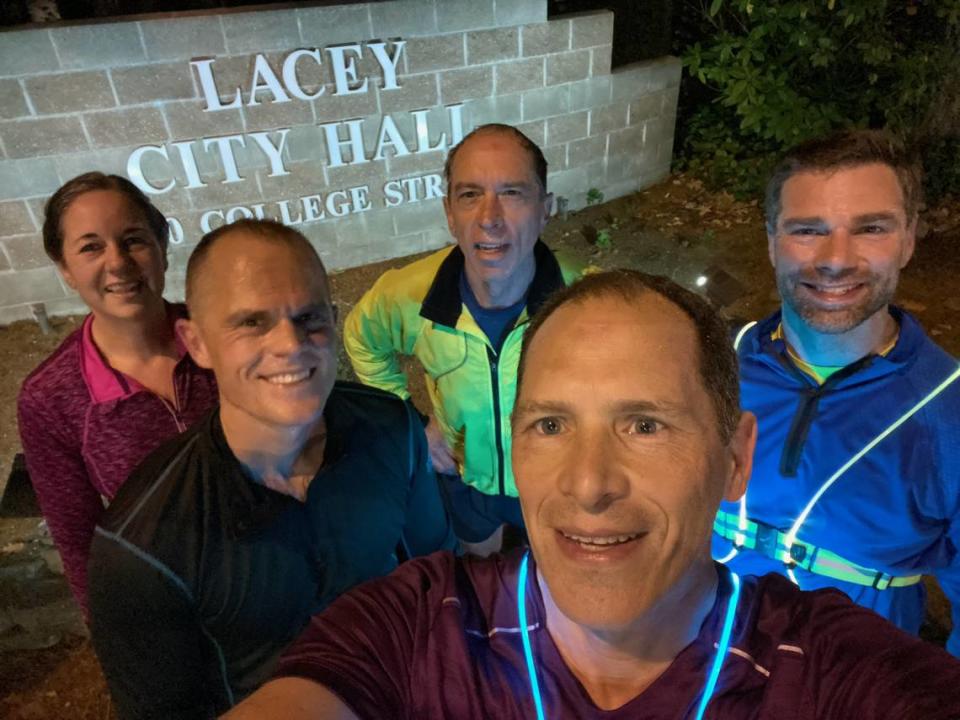 Runner Tom Nelson takes a selfie on the morning of Oct. 24 after spending 18 months running every street in Lacey. Also shown in the photo, clockwise from left: Kevin Hayward, Molly Pestinger, Bill Knight and Michael Montgomery.