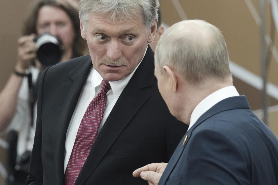 Russian President Vladimir Putin, right, talks to Kremlin spokesman Dmitry Peskov on the sidelines of the Russia-Africa Summit and Economic and Humanitarian Forum in St. Petersburg, Russia, Thursday, July 27, 2023. (Alexei Danichev, Sputnik, Kremlin Pool Photo via AP)