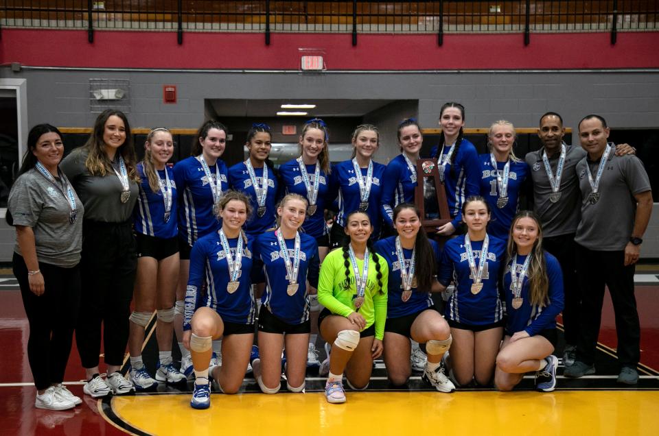 Barron Collier volleyball players take a photo after the FHSAA Class 5A volleyball state championship on Saturday, Nov. 12, 2022, at Polk State College in Winter Haven.