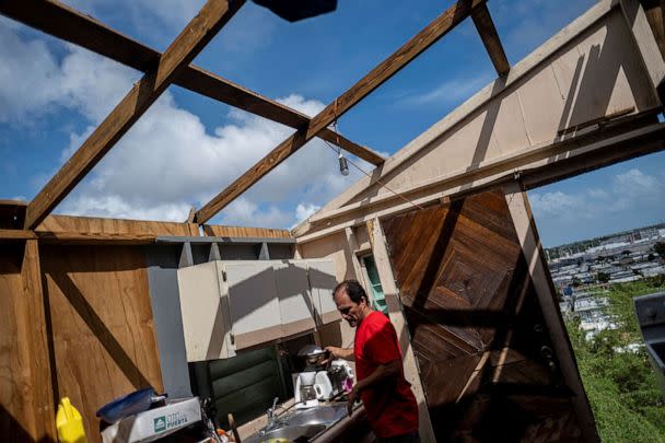 PHOTO: Jorge Luis Baez recovers belongings from his damaged home in the aftermath of Hurricane Fiona in Ponce, Puerto Rico, Sept. 21, 2022. (Ricardo Arduengo/Reuters)