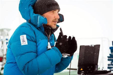 Professor Chris Turney, leader of the Australasian Antarctic Expedition, is pictured talking to international media from the top deck of the stranded MV Akademik Shokalskiy in Antarctica, December 30, 2013. REUTERS/Andrew Peacock