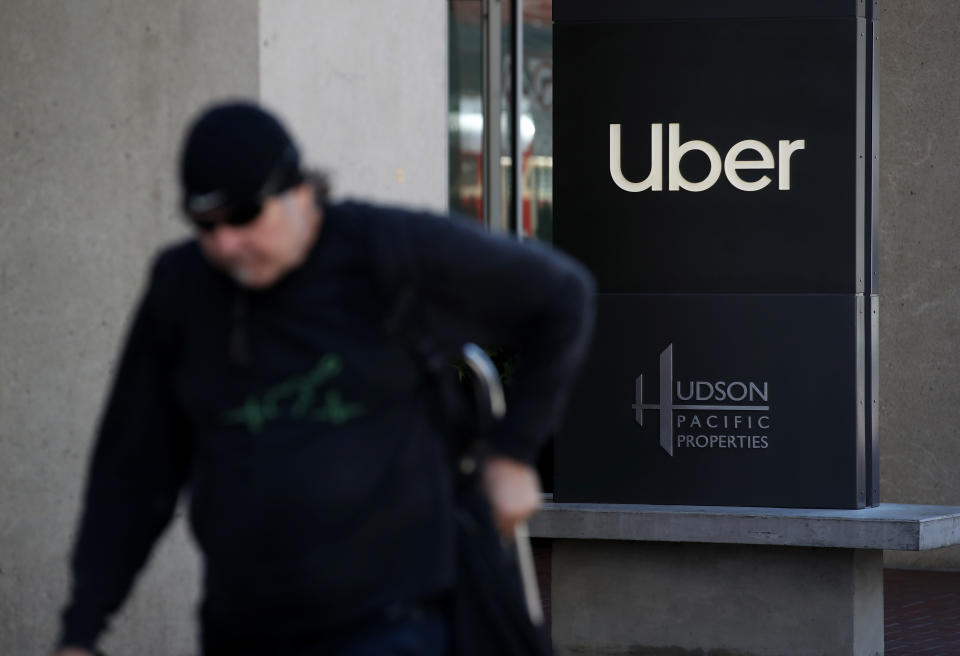 SAN FRANCISCO, CALIFORNIA - SEPTEMBER 23: A pedestrian walks by Uber headquarters on September 23, 2019 in San Francisco, California. Uber's valuation could face an uncertain future after California Assembly Bill AB5 was passed earlier this month and signed by California Gov. Gavin Newsom. The bill could force Uber to reclassify contract workers as employees. The new aw is set to go into effect in January 2020.  (Photo by Justin Sullivan/Getty Images)