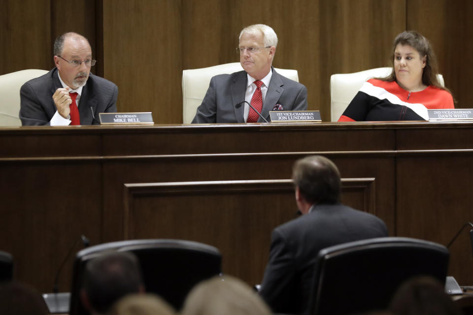 Sen. Mike Bell, R-Riceville, left; Sen. Jon Lundberg, R-Bristol, center; and Sen. Dawn White, R-Murfreesboro, right; listen to the testimony of a speaker during a Senate hearing to discuss a fetal heartbeat abortion ban, or possibly something more restrictive, Monday, Aug. 12, 2019, in Nashville, Tenn. (AP Photo/Mark Humphrey)