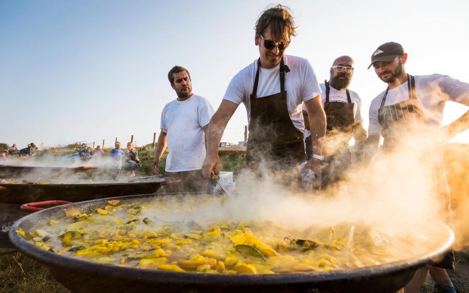 Simon Stallard at the helm of his paella pan - Sally Mitchell