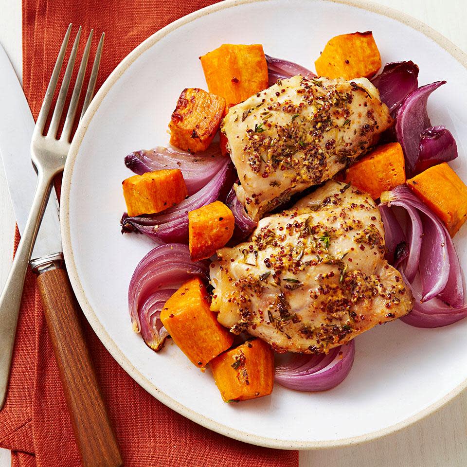 <p>This sheet-pan dinner combines chicken thighs and sweet potatoes for a healthy dinner that cooks up fast in a very hot oven. Serve with a fall salad of mixed greens, sliced apples and blue cheese. <a href="https://www.eatingwell.com/recipe/250549/roast-chicken-sweet-potatoes/" rel="nofollow noopener" target="_blank" data-ylk="slk:View Recipe" class="link ">View Recipe</a></p>