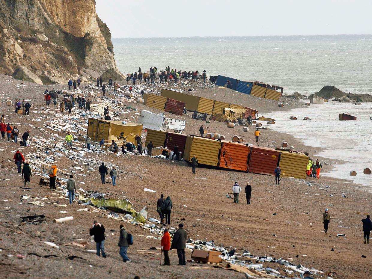 BRANSCOMBE, UNITED KINGDOM - JANUARY 22: Locals remove cargo from the stricken cargo ship MSC Napoli on January 22, 2007 in Branscombe, England. Salvage experts are trying to pump the remaining oil from the stricken ship lying off the southern English coa