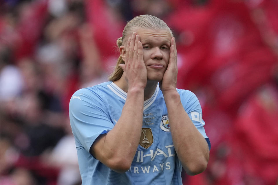 FILE - Manchester City's Erling Haaland reacts at the end of the English FA Cup final soccer match between Manchester City and Manchester United at Wembley Stadium in London, Saturday, May 25, 2024. The most feared striker in Europe won’t be playing at the European Championship. That’s because Erling Haaland’s Norway didn’t qualify. Other big names missing from the Euros include Karim Benzema, Marcus Rashford, Mats Hummels and Sandro Tonali. (AP Photo/Kin Cheung, File)