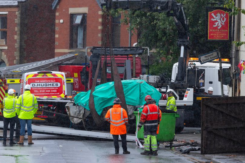 The car was later removed onto a recovery truck -Credit:Manchester Evening News