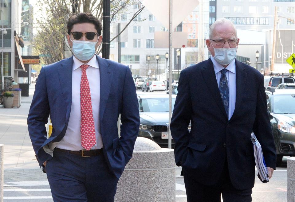 Former Fall River Mayor Jasiel Correia, left, arrives at John Joseph Moakley federal couthouse  with his attorney Kevin Reddington,  Tuesday, April  20, 2021 in Boston. Correia's trial on twenty four charges of fraud, extortion and corruption is set to begin. 