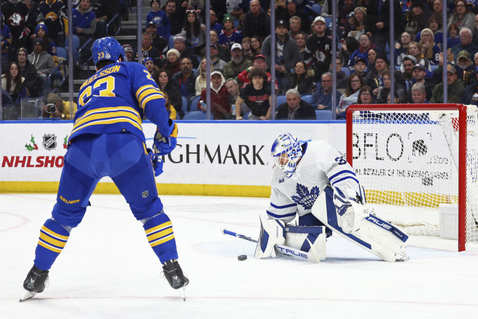 Buffalo Sabres defenseman Mattias Samuelsson (23) is stopped by Toronto Maple Leafs goaltender Ilya Samsonov (35) during the first period of an NHL hockey game Thursday, Dec. 21, 2023, in Buffalo, N.Y. (AP Photo/Jeffrey T. Barnes)